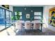 Elegant dining room with modern lighting, stylish seating, and bright light, perfect for entertaining at 421 Dexter St, Denver, CO 80220