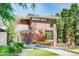 Contemporary two-story home with a modern design, clean lines, and lush greenery at 421 Dexter St, Denver, CO 80220