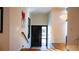 Bright foyer with modern lighting and a unique artwork enhancing the space at 421 Dexter St, Denver, CO 80220