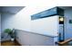 Hallway with hardwood floors, modern lighting, skylight, and crisp, clean design at 421 Dexter St, Denver, CO 80220