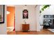 Stylish hallway with hardwood floors and modern art creating an inviting atmosphere at 421 Dexter St, Denver, CO 80220