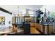 Modern kitchen with a large center island, stainless steel appliances, and custom cabinetry at 421 Dexter St, Denver, CO 80220
