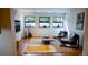 Bright living room features hardwood floors, stylish rugs, comfortable seating, and natural light at 421 Dexter St, Denver, CO 80220