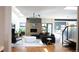 Bright living room featuring modern decor, hardwood floors, and a cozy fireplace at 421 Dexter St, Denver, CO 80220