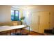 Bright and modern office space with ample natural light, desk, and built-in storage at 421 Dexter St, Denver, CO 80220