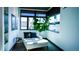 Cozy sitting area with large windows, comfortable chaise lounge, and modern accents at 421 Dexter St, Denver, CO 80220