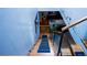 Unique staircase design featuring wooden steps, metal railings, and modern lighting at 421 Dexter St, Denver, CO 80220