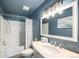 Modern bathroom with a tub-shower combo and stylish vanity mirror at 4844 E 110Th Pl, Thornton, CO 80233