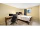 Cozy bedroom featuring a desk and comfortable sleeping space by the window at 4844 E 110Th Pl, Thornton, CO 80233