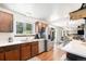 Bright kitchen with stainless steel appliances and a view to dining area at 4844 E 110Th Pl, Thornton, CO 80233