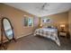 Spacious bedroom featuring carpet, two scenic windows, and ample natural light at 12933 Upper Ridge Rd, Conifer, CO 80433