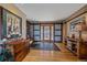 Elegant foyer with sliding barn doors, hardwood floors, and stylish decor at 12933 Upper Ridge Rd, Conifer, CO 80433