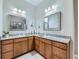 Elegant bathroom with dual sinks, granite countertops, and custom cabinetry at 4420 White Rock Dr, Broomfield, CO 80023