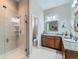 Contemporary bathroom featuring dual vanity sinks, a glass shower, and stylish tile flooring at 4420 White Rock Dr, Broomfield, CO 80023
