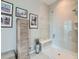 Spa-like bathroom showcasing a seamless glass shower, a built-in bench, and modern fixtures at 4420 White Rock Dr, Broomfield, CO 80023