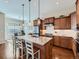 Open concept kitchen with an island, stainless steel appliances, and ample cabinet space at 4420 White Rock Dr, Broomfield, CO 80023