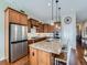 Gourmet kitchen featuring stainless steel appliances, granite countertops and a large island with bar seating at 4420 White Rock Dr, Broomfield, CO 80023