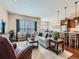 Open concept living area flows seamlessly into the dining and kitchen, perfect for entertaining at 4420 White Rock Dr, Broomfield, CO 80023