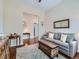 Comfortable interior featuring a stylish couch, a wooden cabinet, and hardwood flooring at 4420 White Rock Dr, Broomfield, CO 80023