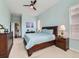 Relaxing main bedroom featuring calming paint, neutral carpet, and an ensuite bathroom at 4420 White Rock Dr, Broomfield, CO 80023
