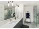 Modern bathroom with double vanity, large shower, and hexagon tile floor at 1750 Wewatta St # 1521, Denver, CO 80202