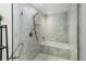 Modern bathroom with a walk-in shower and a soaking tub at 1750 Wewatta St # 1521, Denver, CO 80202