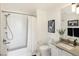 Clean bathroom with white subway tile, bathtub, and modern vanity at 1750 Wewatta St # 1521, Denver, CO 80202
