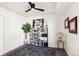 Bright bedroom with built-in shelving, and a ceiling fan at 1750 Wewatta St # 1521, Denver, CO 80202