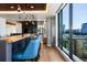 Modern community kitchen with a breakfast bar and city views at 1750 Wewatta St # 1521, Denver, CO 80202