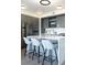 Modern kitchen island with seating for three at 1750 Wewatta St # 1521, Denver, CO 80202