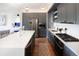 Modern kitchen with gray cabinetry and stainless steel appliances at 1750 Wewatta St # 1521, Denver, CO 80202