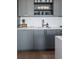 Gray shaker cabinets, white subway tile backsplash, and modern kitchen sink at 1750 Wewatta St # 1521, Denver, CO 80202
