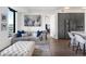 Bright living room features a comfortable sofa and city views at 1750 Wewatta St # 1521, Denver, CO 80202