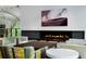 Lobby with fireplace, comfortable seating, and large artwork at 1750 Wewatta St # 1521, Denver, CO 80202