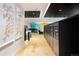 Modern mail room with sleek, dark wood finishes at 1750 Wewatta St # 1521, Denver, CO 80202