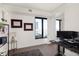 Home office with built-in shelving, large window, and workspace at 1750 Wewatta St # 1521, Denver, CO 80202