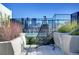 Rooftop deck with a hanging chair and city views at 1750 Wewatta St # 1521, Denver, CO 80202