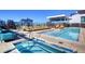 Large rooftop pool with hot tub, lounge chairs, and cabanas at 1750 Wewatta St # 1521, Denver, CO 80202
