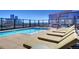Luxury rooftop pool with ample lounge chairs and cityscape backdrop at 1750 Wewatta St # 1521, Denver, CO 80202