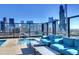 Relaxing rooftop pool and lounge area with city views at 1750 Wewatta St # 1521, Denver, CO 80202