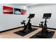 Modern spin studio with Peloton bikes and floor mats at 1750 Wewatta St # 1521, Denver, CO 80202
