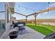 Outdoor patio featuring a grill, table, and overhead string lights for relaxing evenings at 18079 E 108Th Pl, Commerce City, CO 80022