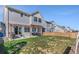 Large backyard features a covered patio, wood fence and expansive lawn at 18079 E 108Th Pl, Commerce City, CO 80022