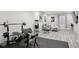 Finished basement with workout area, seating, and a movie viewing area at 18079 E 108Th Pl, Commerce City, CO 80022
