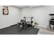 Finished basement area featuring workout equipment, movie snacks, and hardwood floors at 18079 E 108Th Pl, Commerce City, CO 80022