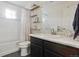 Bathroom with a shower-tub combo, white and grey tiles and shelving at 18079 E 108Th Pl, Commerce City, CO 80022