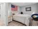 Simple bedroom featuring neutral walls, hardwood floors, and a modern ceiling fan at 18079 E 108Th Pl, Commerce City, CO 80022