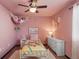 Charming bedroom with a playful decor, a ceiling fan, and a cozy, inviting atmosphere at 18079 E 108Th Pl, Commerce City, CO 80022