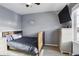 A well-lit bedroom features hardwood floors, gray walls, and a basketball hoop at 18079 E 108Th Pl, Commerce City, CO 80022