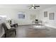 Bright bonus room with wood floors, a ceiling fan, modern decor and plenty of natural light from the window at 18079 E 108Th Pl, Commerce City, CO 80022